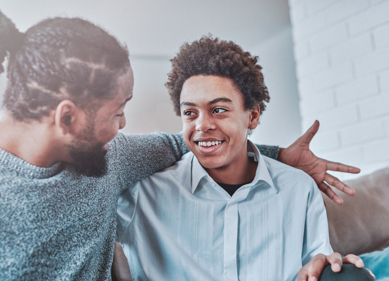 Dad and son talking about mental health