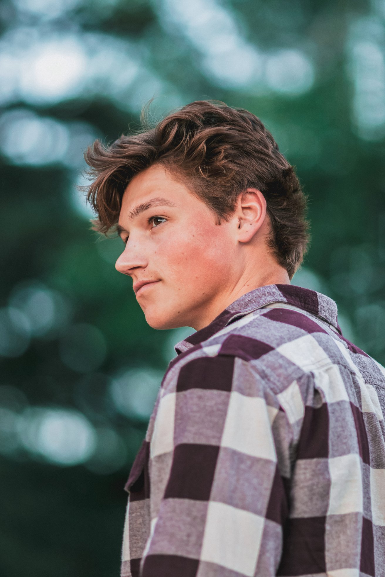 Teen boy looking off to the side