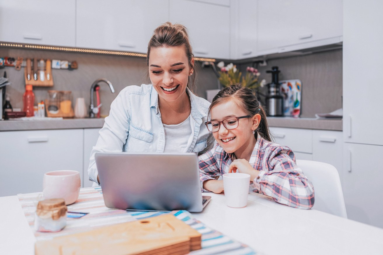Mom and daughter at the computer together