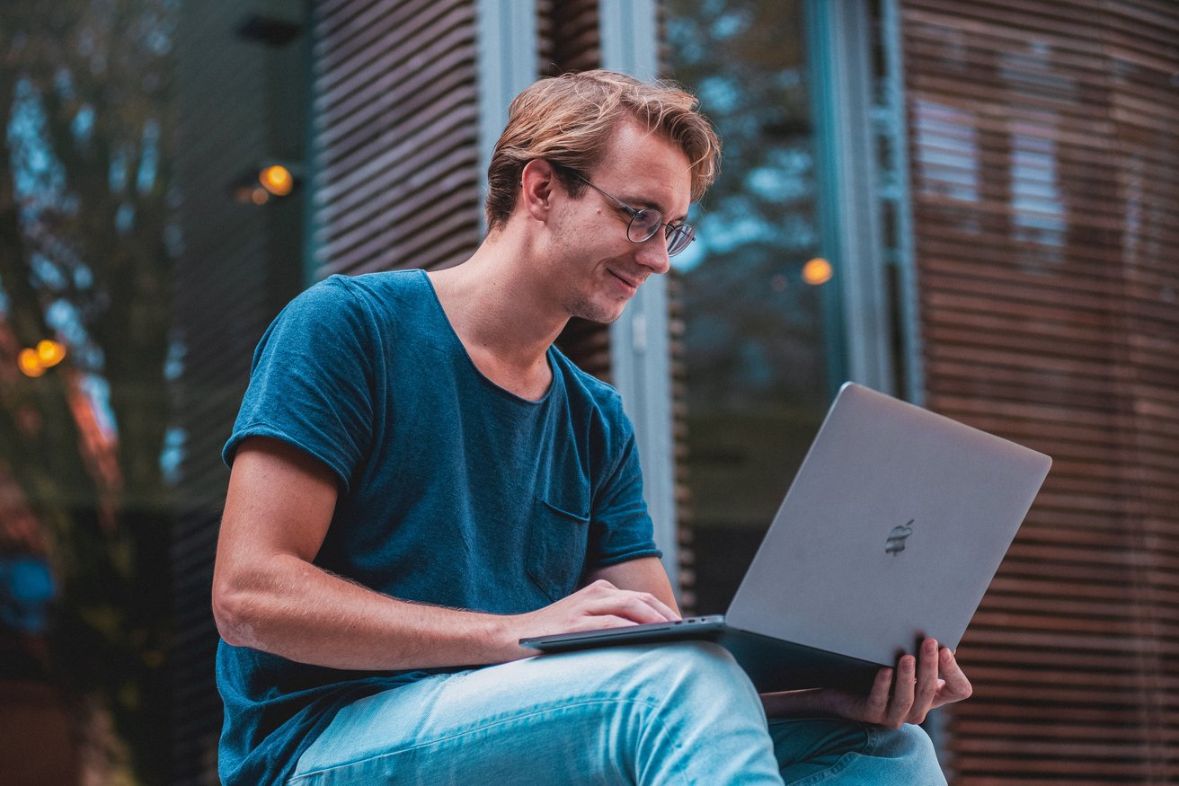Young adult man on his laptop