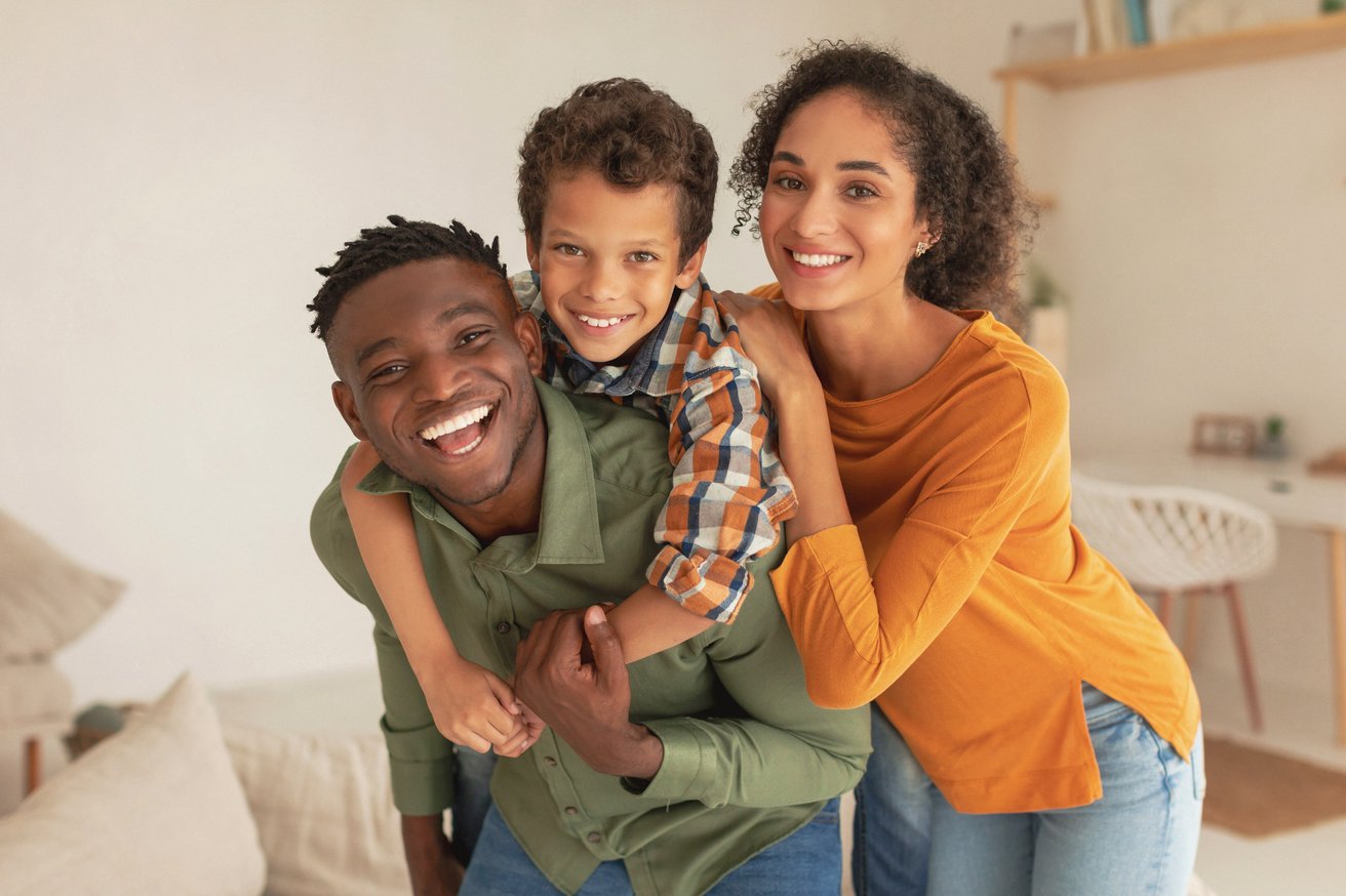 Dad, son, and mom, happy together