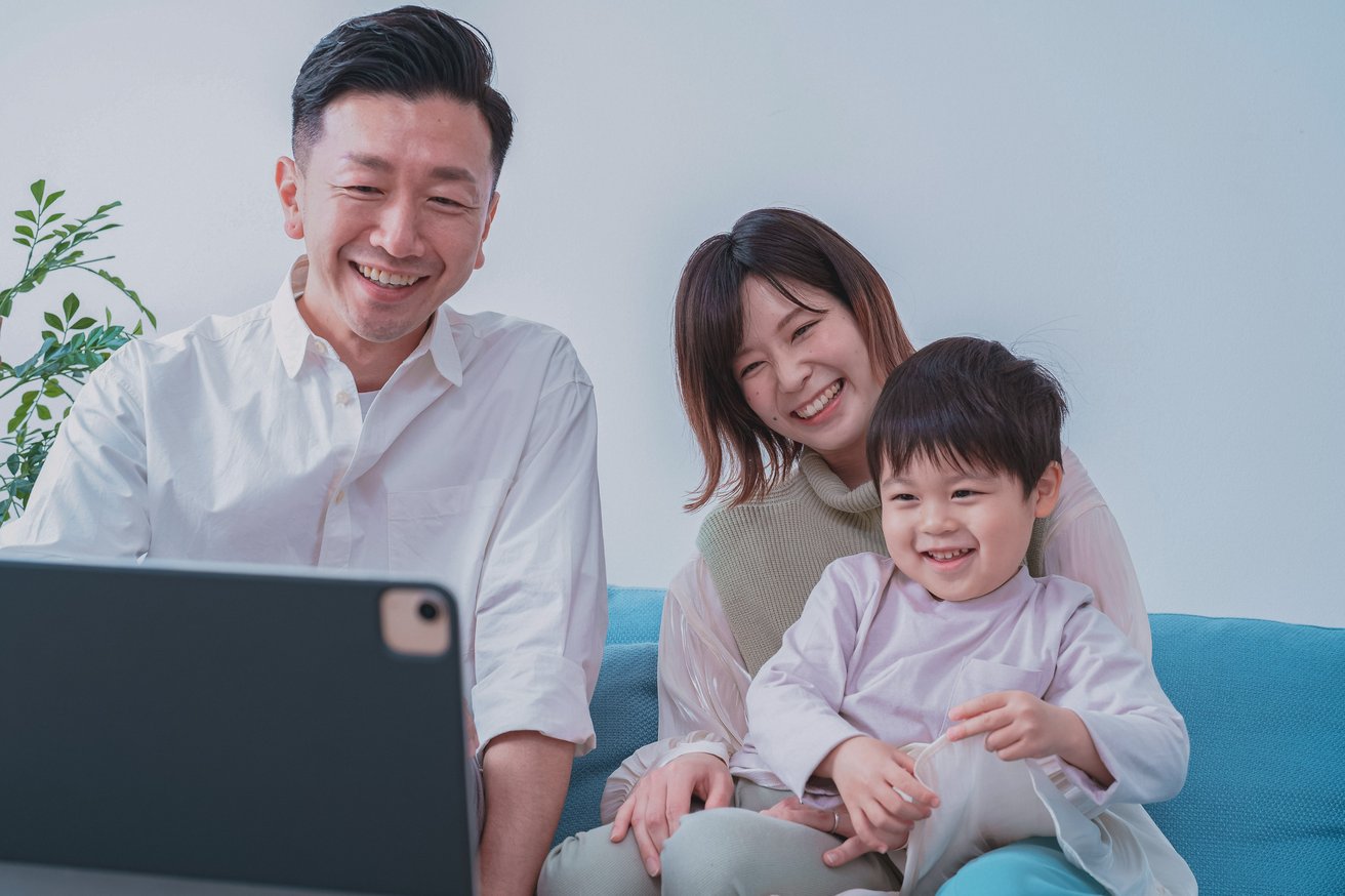 Family looking at computer together