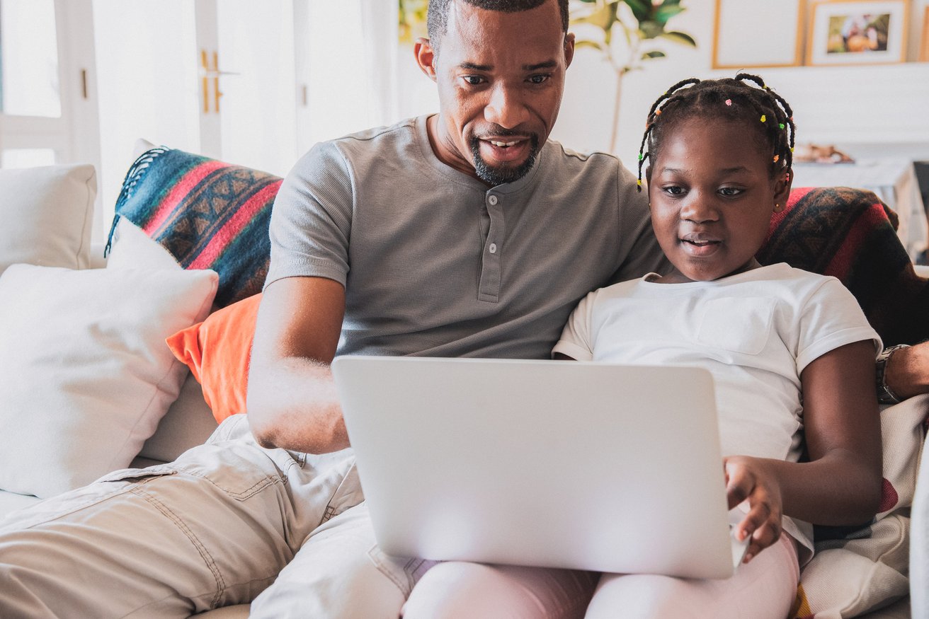 Father and young daughter in virtual therapy session