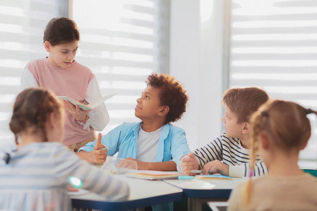 Kids talking in a classroom