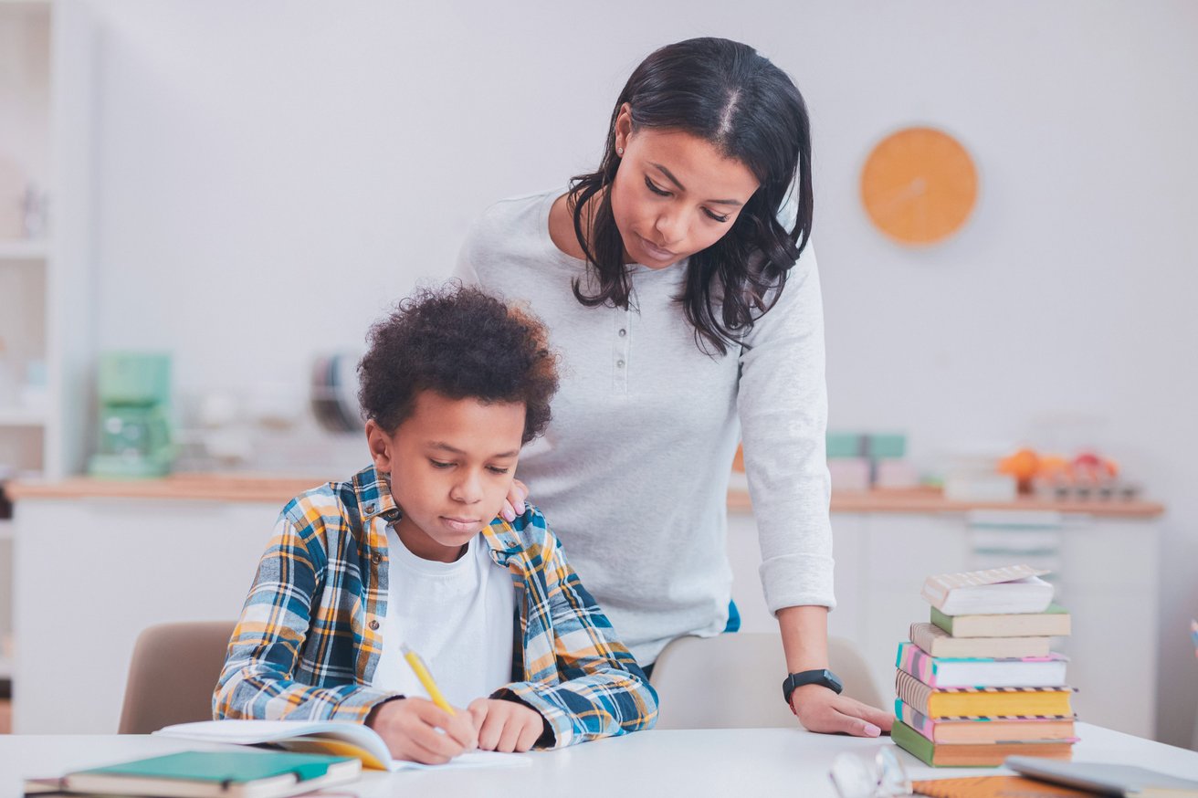 Parent helping her child with schoolwork