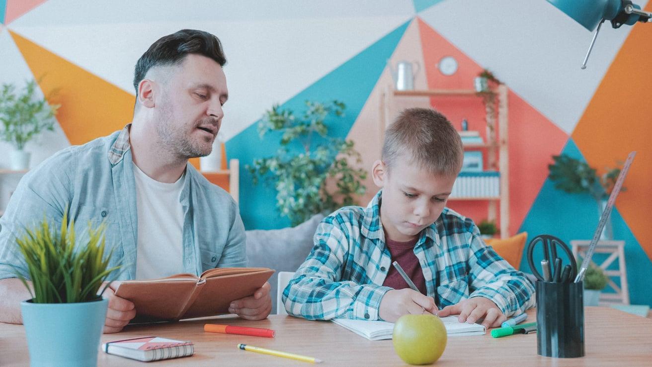 Parent helping kid with adhd with homework