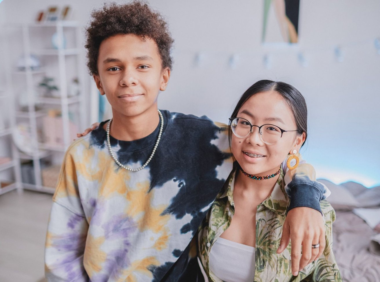 Teen boy and girl looking at the camera