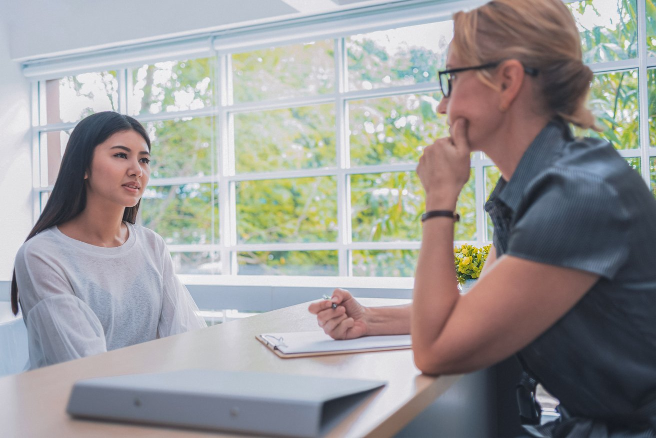 Teen girl talking to school counselor