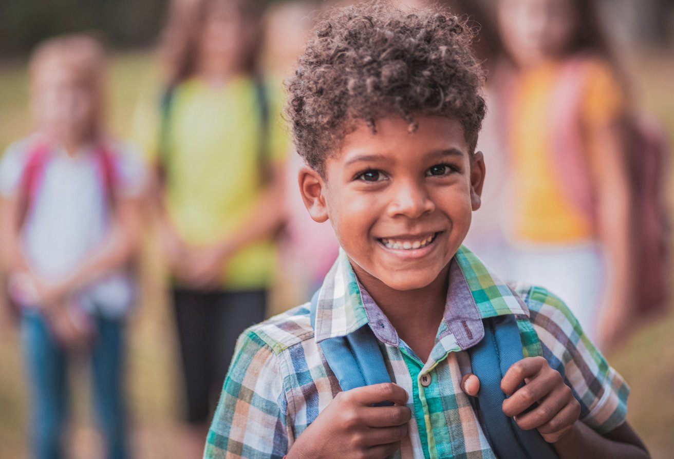 young boy smiling at camera