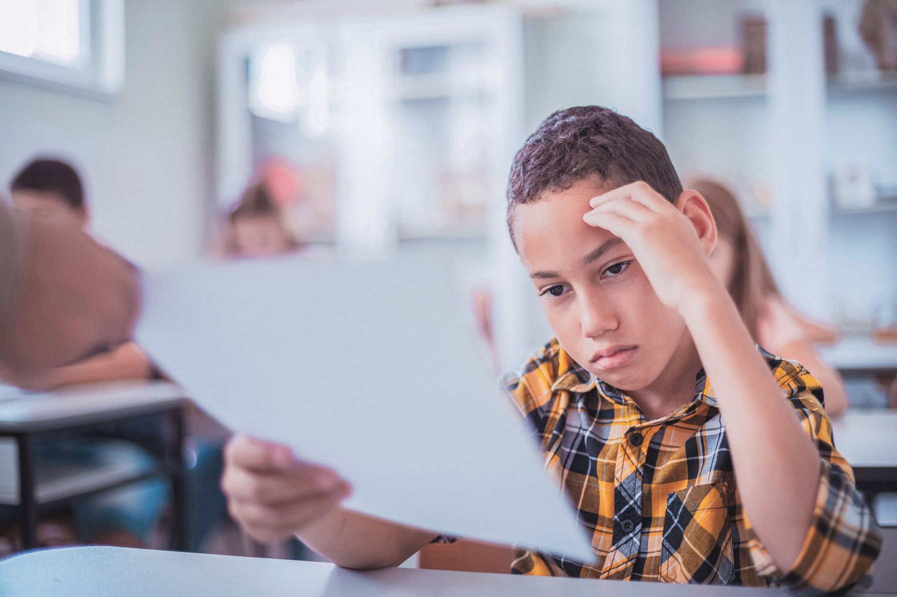 Child getting a poor grade on an assignment