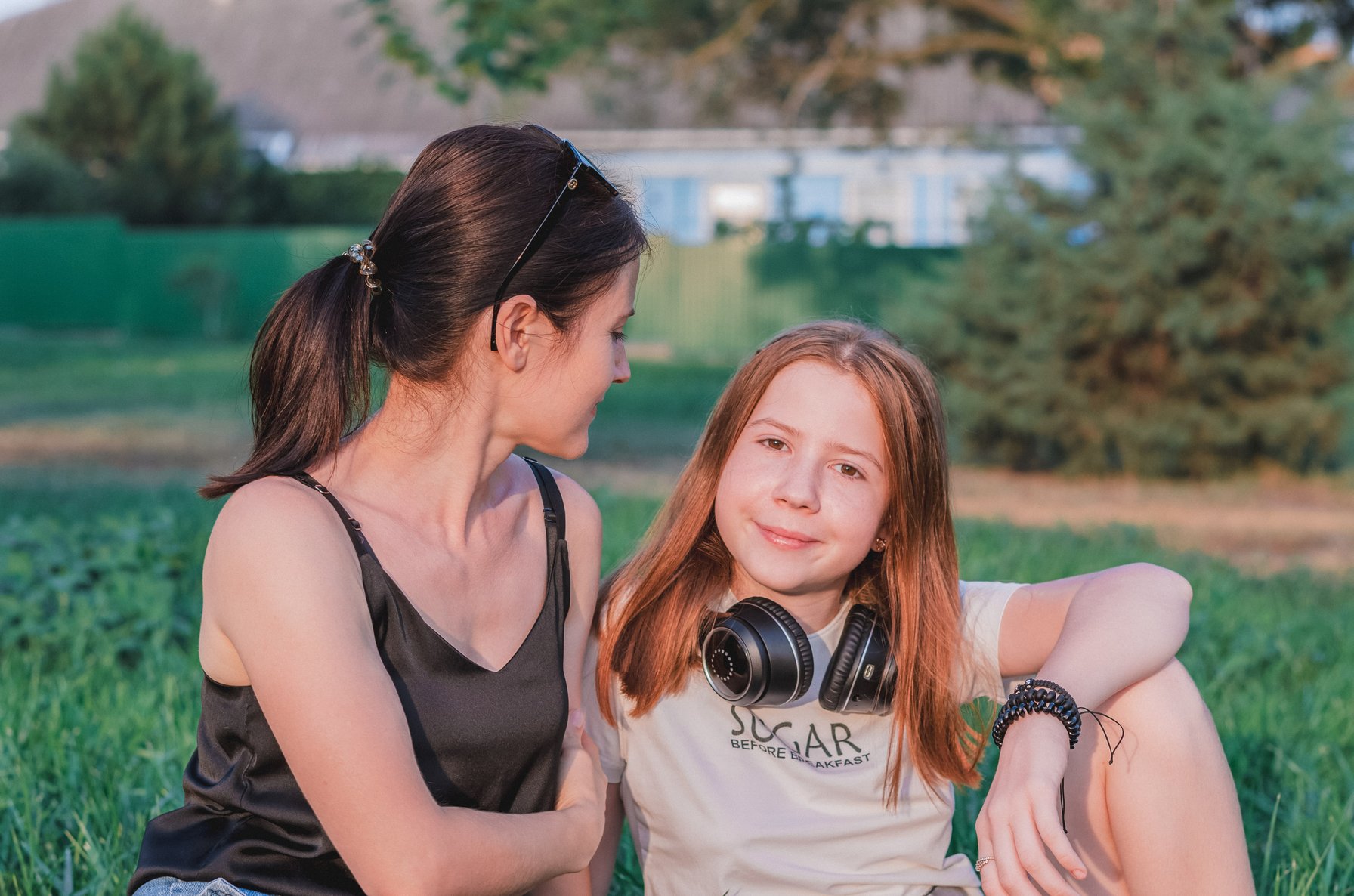 Mom and daughter relaxing in a park