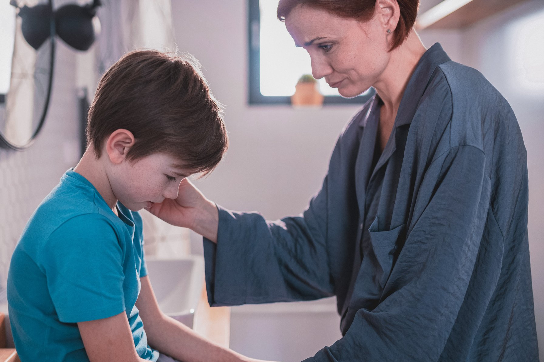 Mom comforting son dealing with the loss of a family member