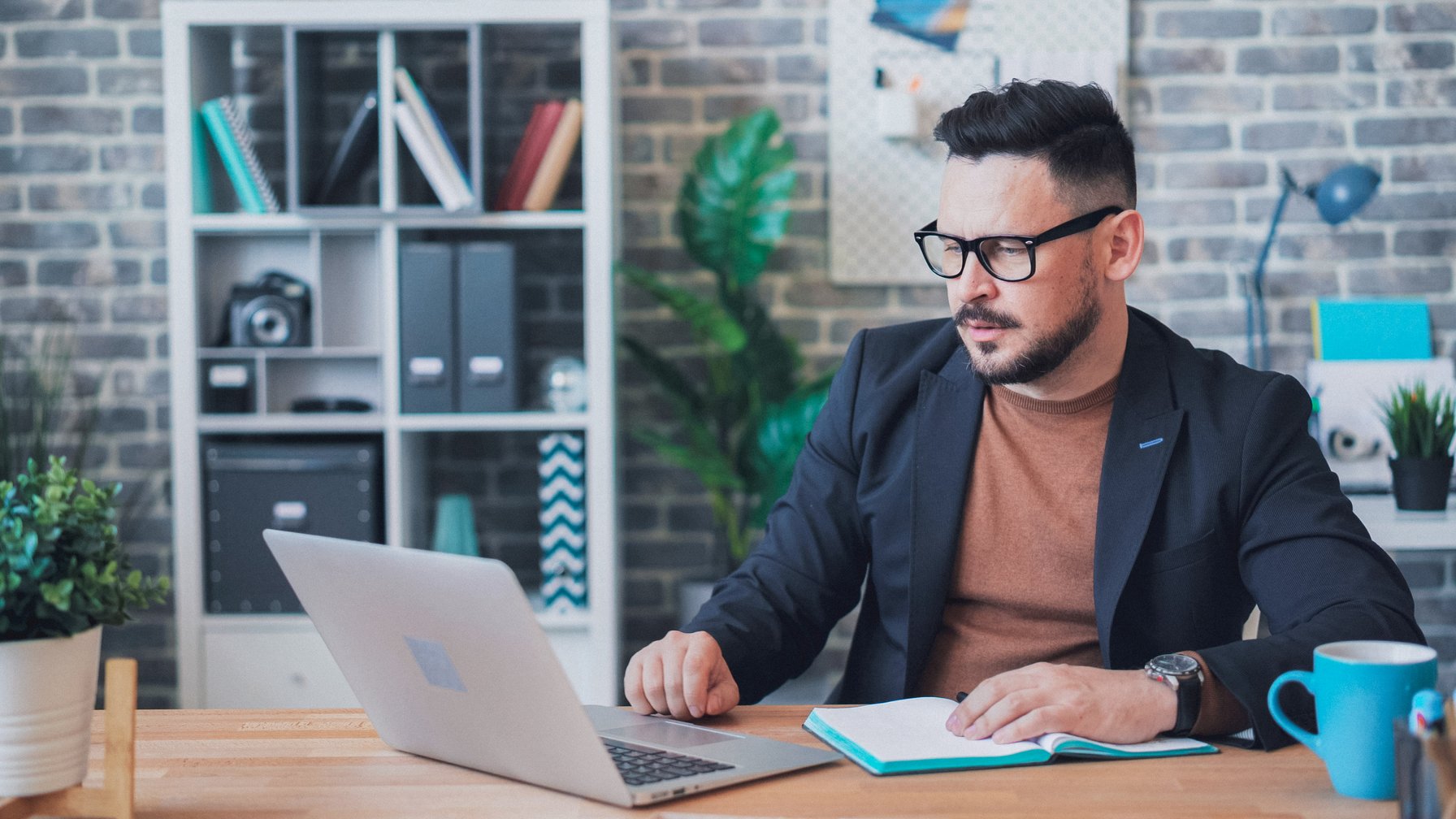 Therapist taking notes and conducting an online therapy session